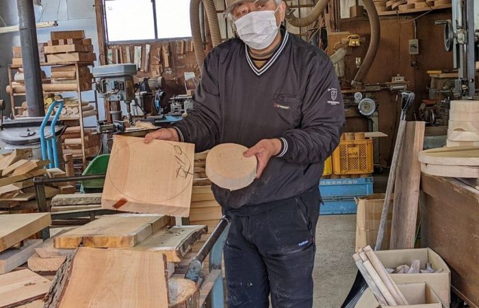 Wood craftsman explaining about his work