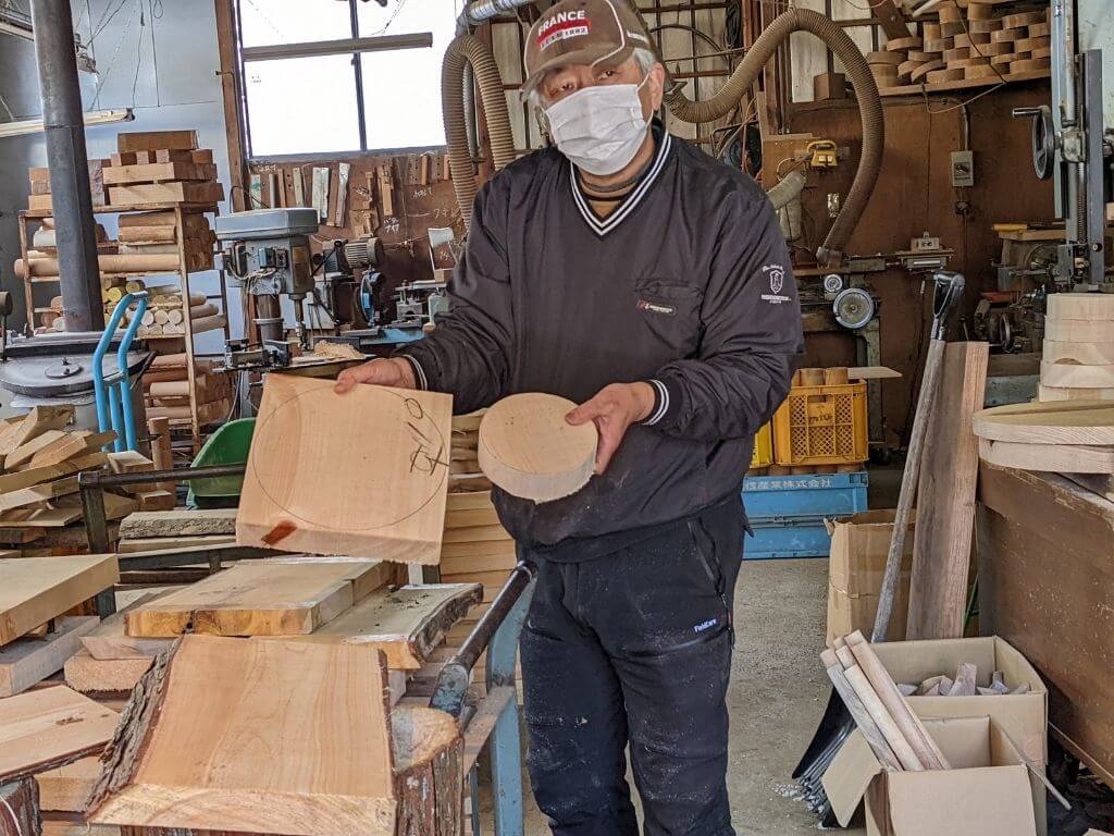 Wood craftsman explaining about his work