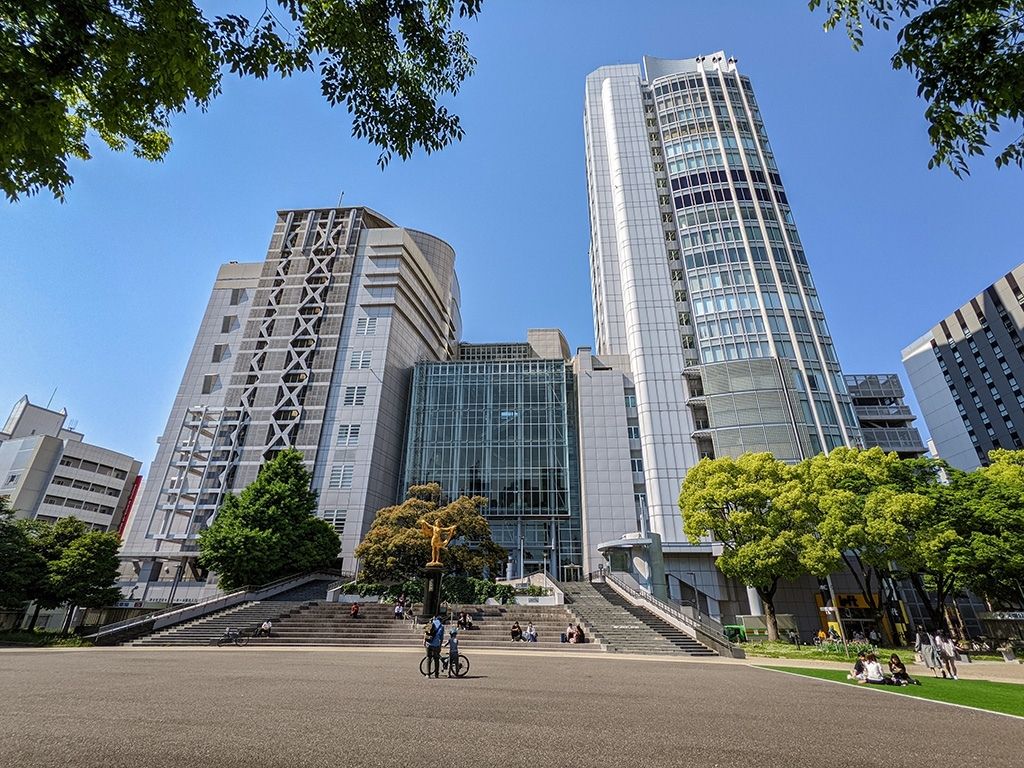 The building is split into two halves: offices on the left and shopping on the right. 