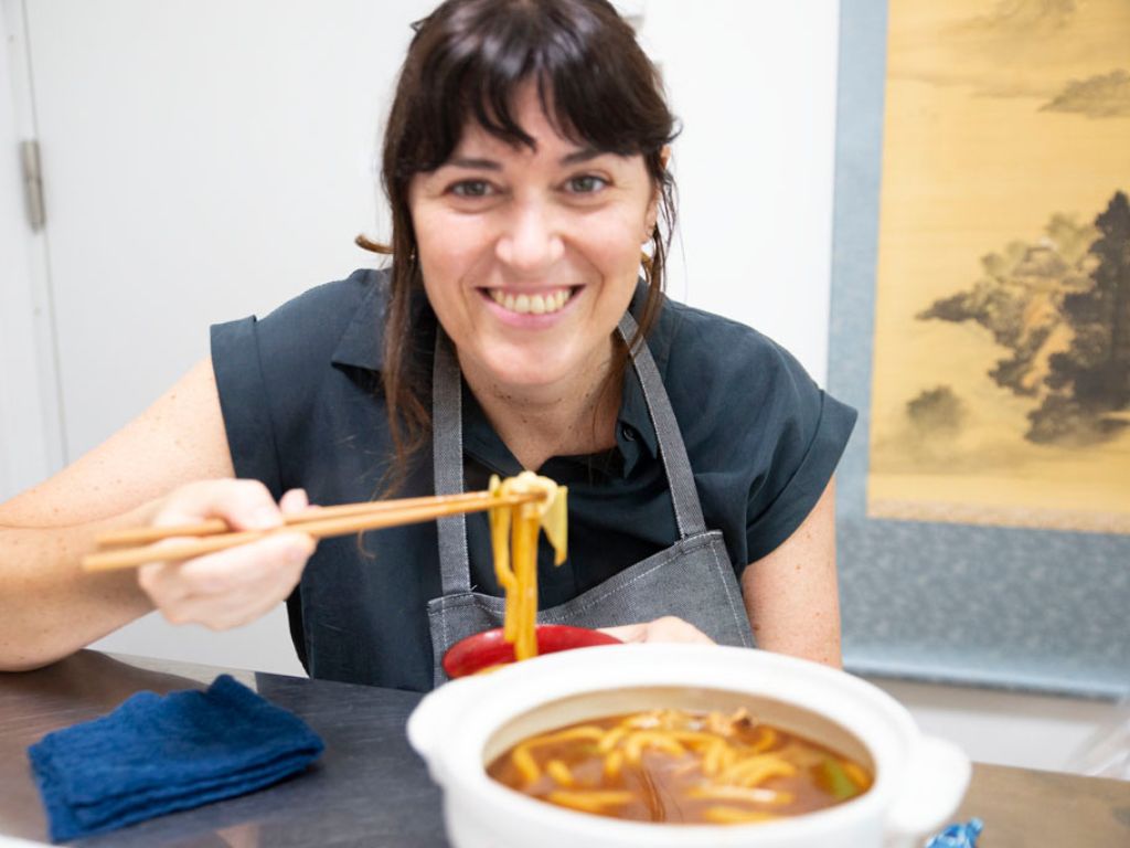 A happy face after tasting Miso Nikomi Udon