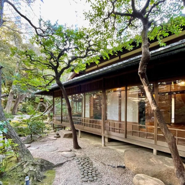 teaceremony (8) The exterior of a Japanese teahouse in the woods.