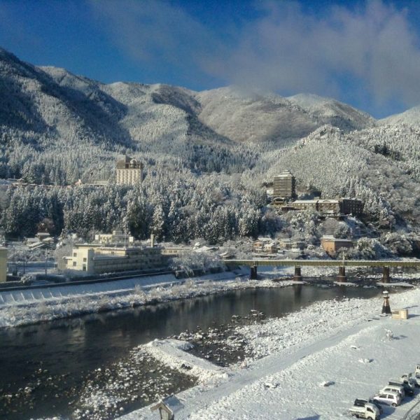 The onsen town of Gero, with the riverbanks and mountains covered in powdery snow.