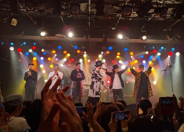 Six performers salute the crowd at Club Quattro.