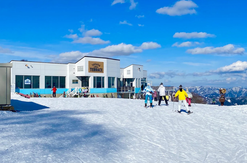 The ski-in area to Takasu Terrace on a bright, blue sky day.