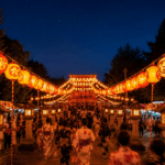 The lantern-lit entry to a Bon Odori festival at night, with all participants dressed up in floral yukata.
