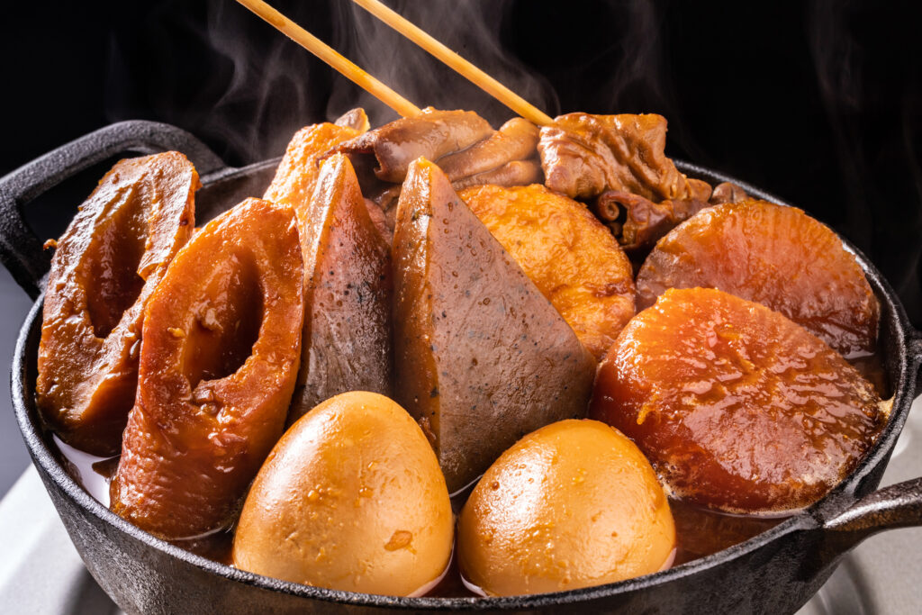 A steaming hotpot of miso oden with konnyaku, fish, eggs, daikon, and more.