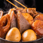 A steaming hotpot of miso oden with konnyaku, fish, eggs, daikon, and more.
